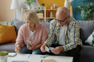 An older couple going over their finances at home